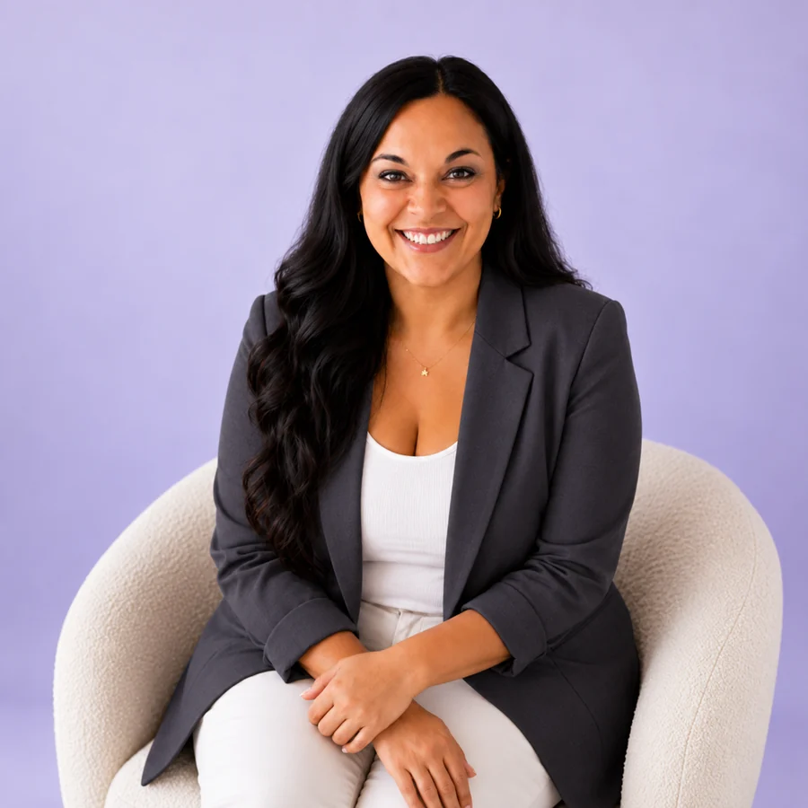 Joyce Agne in a charcoal blazer, seated and smiling
