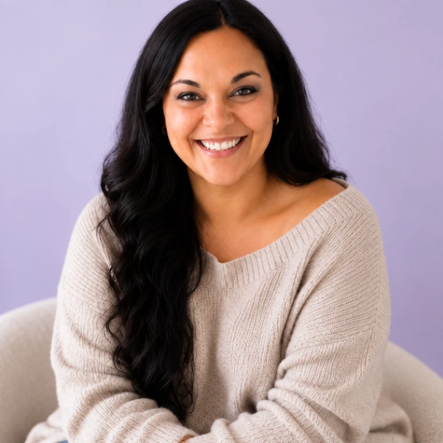 Joyce Agne in a soft cream sweater, smiling